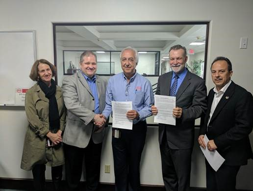 Left to right: Madeline Janis, executive director of transit workers advocacy group Jobs to Move America; James White, director of organizing at the Sheet Metal, Air, Rail and Transportation Workers union; BYD Senior Vice President Macy Neshati; Lancaster Mayor R. Rex Parris; Luther Medina, business manager of SMART Local 105 following successful completion of the card-check process.