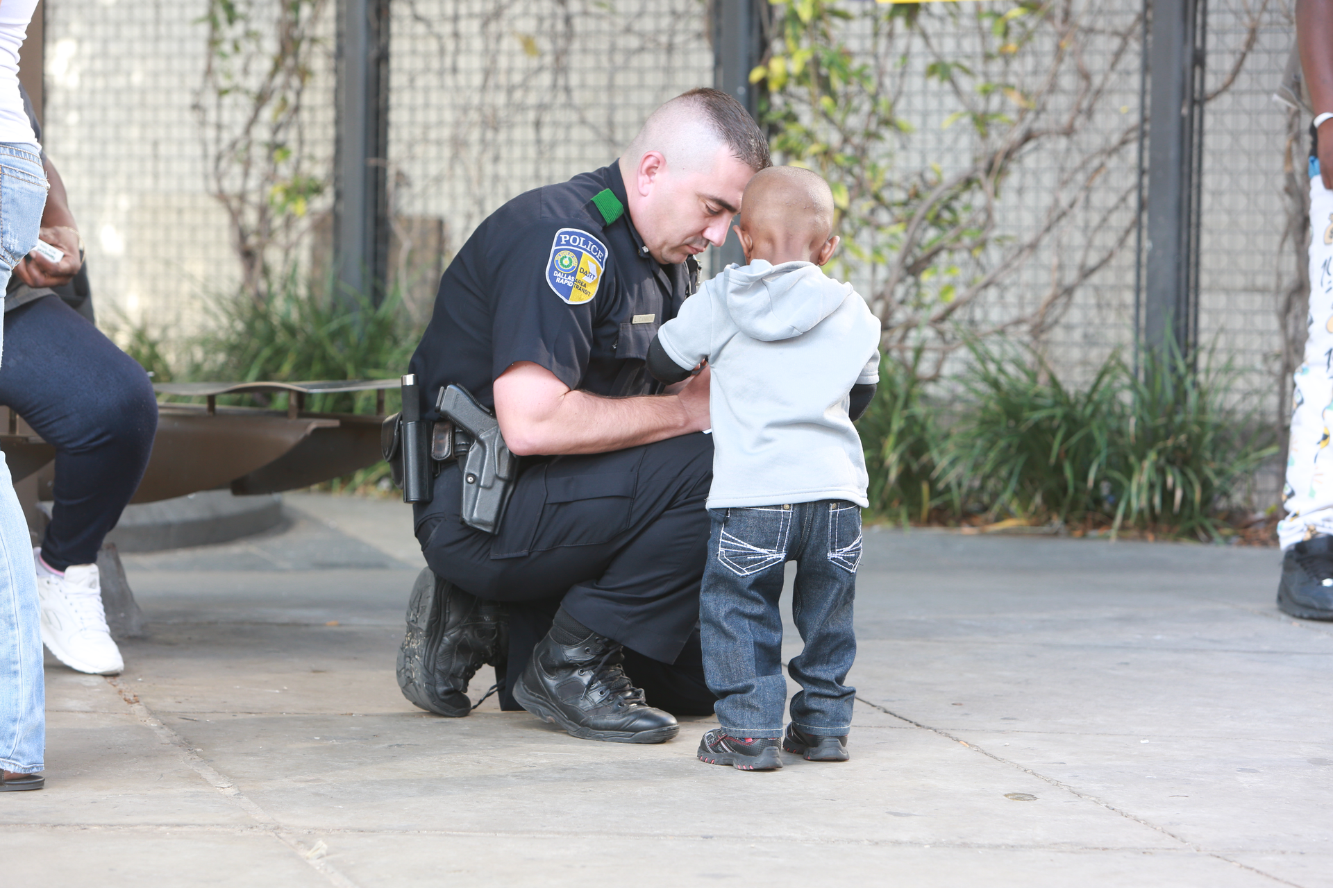 Dallas Area Rapid transit officer with youth.