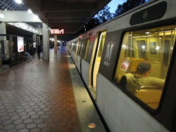Washington Metropolitan Area Transit Authority Red Line train at Grosvenor-Strathmore station from under canopy.