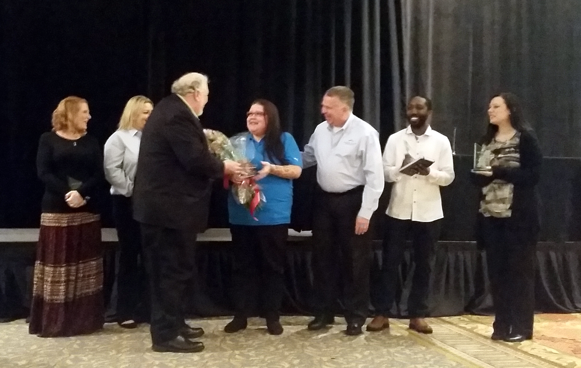 Iliana Mena receives her award.