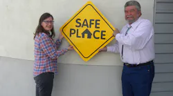 NCRTD Chair and Town of Taos Mayor, Daniel Barrone (R), and Stacey McGuire (L), NCRTD Planning, Projects & Grants Manager, display a copy of the Safe Place sign that has been placed on the RTD fleet of buses.