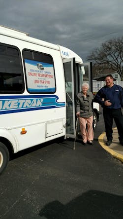 Dial-a-Ride driver assisting rider. Dial-a-Ride driver assisting rider.