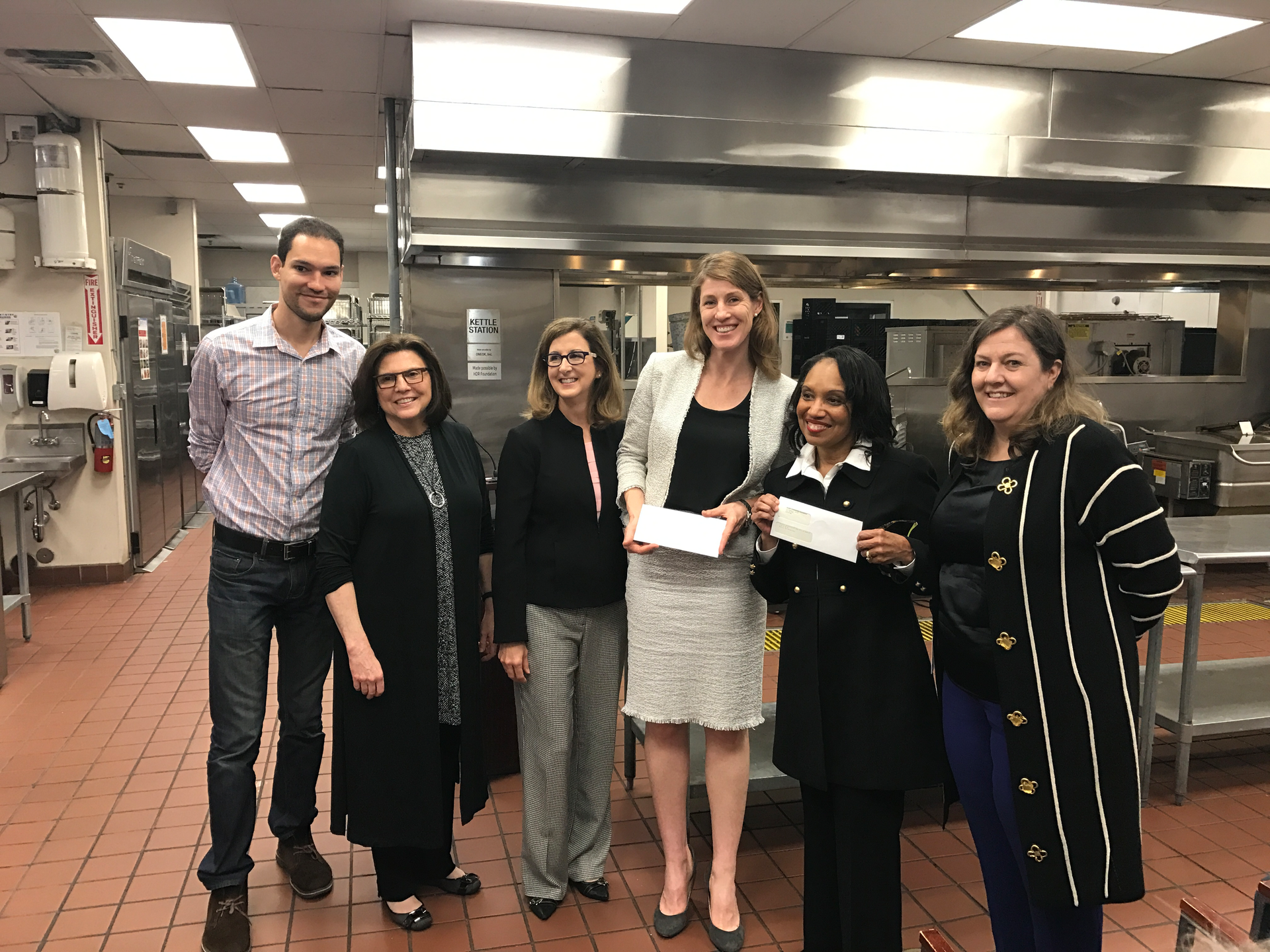 At a media event, the two project partners each received a check for $50, 000.