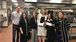 At a media event, the two project partners each received a check for $50, 000.