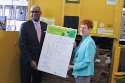 Metro CEO Dwight A. Ferrell and Metro Sustainability & Outreach Manager Kim Lahman recently signed Metro's sustainability policy at an Earth Day event highlighting Metro's initiatives to reduce its environmental footprint. Metro CEO Dwight A. Ferrell and Metro Sustainability & Outreach Manager Kim Lahman recently signed Metro's sustainability policy at an Earth Day event highlighting Metro's initiatives to reduce its environmental footprint.
