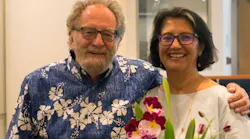MTC Chair Jake Mackenzie presents MTC Senior Public Information Officer Catalina Alvarado with some flowers at the May 24, 2017 Commission meeting.