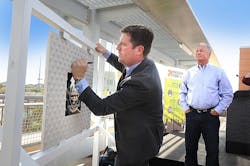 The signing of a commemorative plaque marks the start of construction on the 50th St/Washington Valley Metro Rail station. Phoenix Mayor Greg Stanton adds his signature to the plaque, which will be incorporated into the new station, as the owner of Stockyards Restaurant and Jokake Real Estate Services Gary Smith looks on. The signing of a commemorative plaque marks the start of construction on the 50th St/Washington Valley Metro Rail station. Phoenix Mayor Greg Stanton adds his signature to the plaque, which will be incorporated into the new station, as the owner of Stockyards Restaurant and Jokake Real Estate Services Gary Smith looks on.
