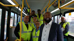 Clinton Forbes, Executive Director (right) poses with bus operators.