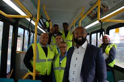 Clinton Forbes, Executive Director (right) poses with bus operators.