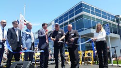 Most-tenured Gillig employee Stanley Alcon, with 50 years of service, cuts the ribbon. Most-tenured Gillig employee Stanley Alcon, with 50 years of service, cuts the ribbon.