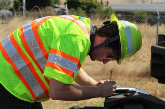 Colin McGill making notes in the field as part of his project with the Track Department.