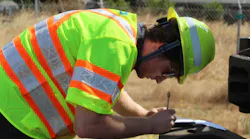 Colin McGill making notes in the field as part of his project with the Track Department.