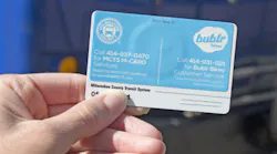 Buslr sticker on back of an M•CARD.