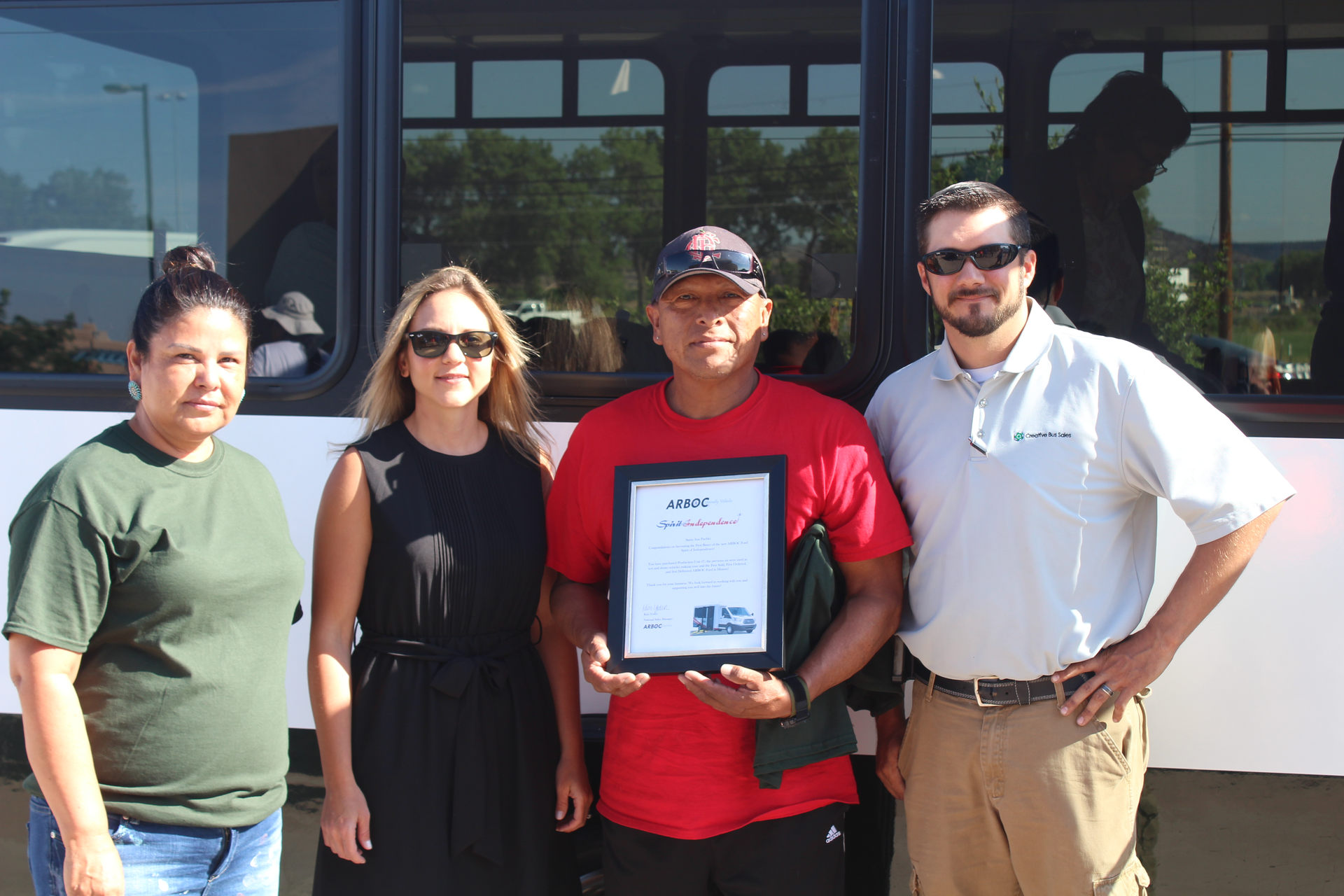 Pictured left to right: Dorothy Claw, Kim Yoder of ARBOC Specialty Vehicles, Governor Montoya, Gary Guinn of Creative Bus Sales.