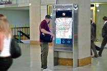 Intersection&rsquo;s interactive kiosk at Southeastern Pennsylvania Transportation Authority&apos;s Suburban Station. By generating data that helps transit agencies understand the real-time status of their system, they can respond to customer needs. Kiosks can combine interactive wayfinding, service changes, and real-time arrivals customized to the station or platform where the kiosk is located.