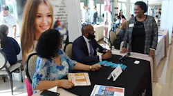 From left to right, Palm Tran DBE Grants Coordinator Claudia Salazar and Executive Director Clinton B. Forbes answer questions from vendors.