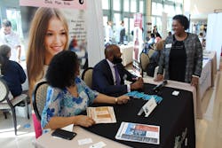 From left to right, Palm Tran DBE Grants Coordinator Claudia Salazar and Executive Director Clinton B. Forbes answer questions from vendors.