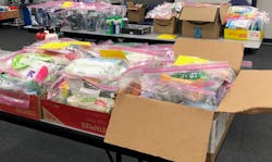 Donated items waiting to be loaded into backpacks. Donated items waiting to be loaded into backpacks.