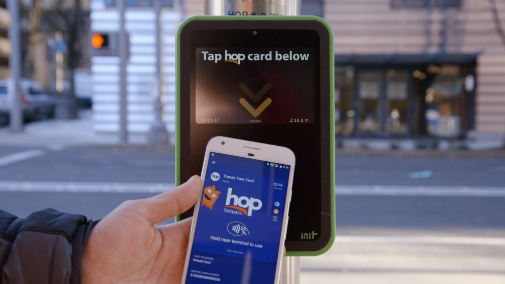 The Hop Fastpass Commuters in the Portland-Vancouver Metropolitan Area can use a mobile wallet or any contactless bank card to tap and ride on TriMet, C-TRAN and the Portland Streetcar. INIT&rsquo;s MOBILEvario powers the account-based, open payment system and manages and processes fares in real-time, recognizes and processes revenue sharing, as well as manages accounts and automates reconciliations for all three agencies. INIT developed the system using open architecture APIs so other partners could be easily incorporated. TriMet partnered with Google to make the Hop Fastpass the first virtual transit card available in Android Pay. Beta testing started in December, giving a select group of testers the opportunity to load a virtual Hop card in Android Pay, allowing them to tap their phones to pay their fares. MassTransitmag.com/12362197 &centerdot; MassTransitmag.com/12386556
