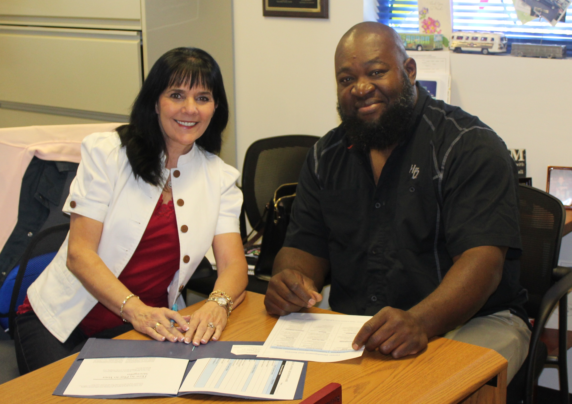 Palm Tran Organizational Development Manager Liliane Finke, Ed.D oversees the Upward Mobility Program, and Christopher Love, who has gone through the program and has since been promoted to a maintenance technician.