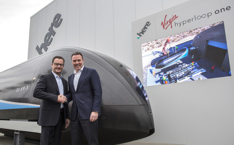 CEO of Virgin Hyperloop One, Rob Lloyd and CEO of HERE Technologies Edzard Overbeek at the unveiling of the first-generation pod at CES 2018.