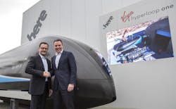 CEO of Virgin Hyperloop One, Rob Lloyd and CEO of HERE Technologies Edzard Overbeek at the unveiling of the first-generation pod at CES 2018. CEO of Virgin Hyperloop One, Rob Lloyd and CEO of HERE Technologies Edzard Overbeek at the unveiling of the first-generation pod at CES 2018.