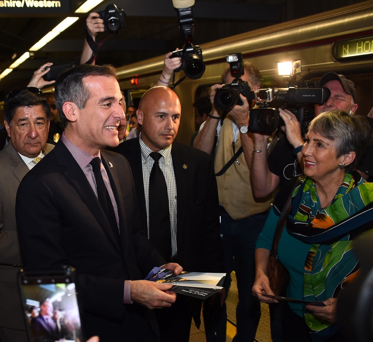 Los Angeles Mayor and Metro Board Chair Eric Garcetti Rides the Metro Red Line subway handing out complimentary 25th Birthday TAP cards to riders.