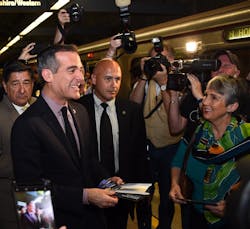 Los Angeles Mayor and Metro Board Chair Eric Garcetti Rides the Metro Red Line subway handing out complimentary 25th Birthday TAP cards to riders. Los Angeles Mayor and Metro Board Chair Eric Garcetti Rides the Metro Red Line subway handing out complimentary 25th Birthday TAP cards to riders.