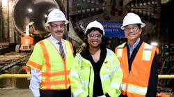 Connector Executive Director Gary Baker, Metro Deputy CEO Stephanie Wiggines and John Yen from Skanska wishing Angeli a Happy Retirement.