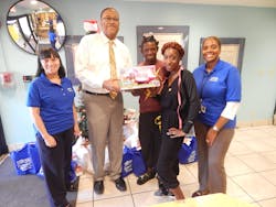 County Transportation Director Chris Walton presents Covenant House residents who are parents of a toddler, with one of the donated items collected through the BCT 2nd Annual Toy Drive. County Transportation Director Chris Walton presents Covenant House residents who are parents of a toddler, with one of the donated items collected through the BCT 2nd Annual Toy Drive.