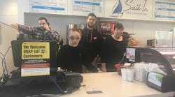 Sail In students and staff pose behind the counter at the Sail In Caf&eacute;. From left to right: Josh Feher (Sail In employee), David Kemske (student), Kyle Duffy (Community Enterprises job trainer), and Kim London (student).