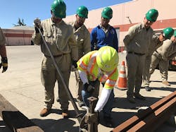 An instructor demonstrates a track jack at Cypress Mandela Training Center. An instructor demonstrates a track jack at Cypress Mandela Training Center.