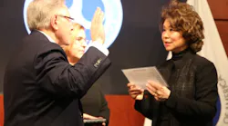 Ronald Batory being sworn in by aecretary Elaine Chao.