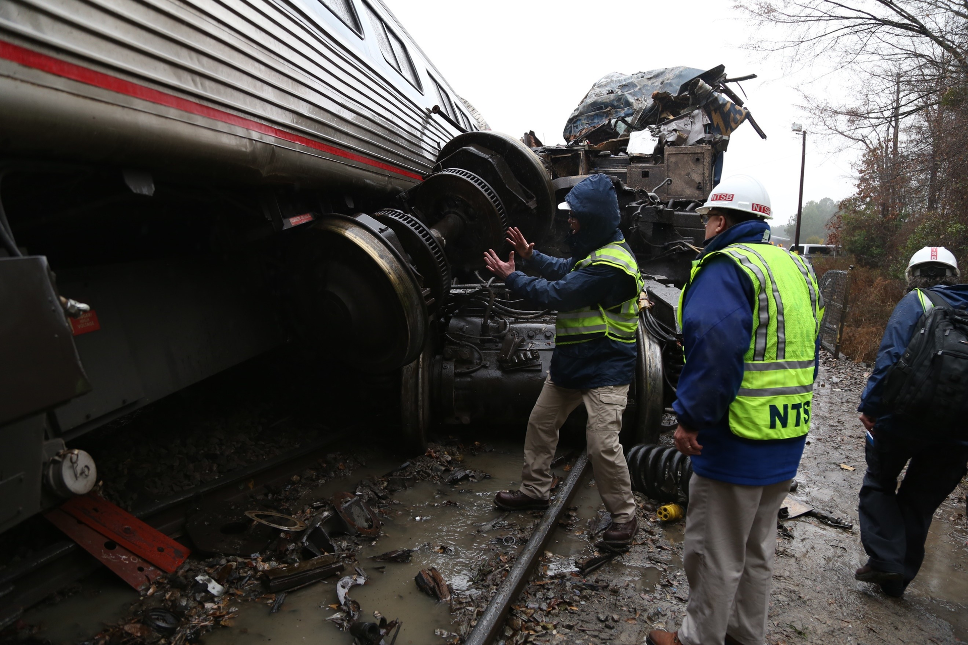 NTSB investigators assess the damage caused by the collision of an Amtrak train and a CSX train Feb. 4, 2018.