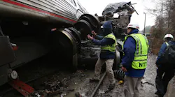NTSB investigators assess the damage caused by the collision of an Amtrak train and a CSX train Feb. 4, 2018.