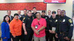 Front (pink shirt) MTS Officer Carlos Paredes benefitted from the quick life-saving actions of his colleagues and an AED device. Back (from L to R): MTS Board Vice Chair Mona Rios, MTS Chief Executive Officer Paul Jablonski, MTS Board Chair Georgette Gómez, MTS Chief of Police Manny Guaderrama, MTS Security Officers Steven Gil, Carlos Caldelas, Brandon Garcia, Alex Masiovecchio, MTS Deputy Director of Transit Enforcement Tim Curran, MTS Security Officers Jeremy Echeverria, Corwin Taylor and Isaiah Alexander
