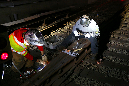 BART Welders Nick Rosales and Orlando Lozano work on an overnight shift.