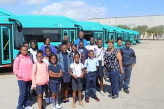 Students from R.J. Hendley Christian Community School in Riviera Beach, FL smile in front of Palm Tran&rsquo;s bus fleet after touring Palm Tran&rsquo;s North County Facility.