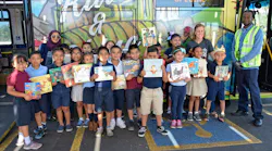 Thew Elementary students celebrate Driving for Books.