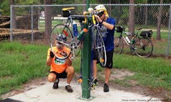 The pearl-green, 6-foot-tall stations are equipped with a tool kit, foot-operated air pump and psi gauge, plus two bars that allow riders to hang their bikes while they repair them. The pearl-green, 6-foot-tall stations are equipped with a tool kit, foot-operated air pump and psi gauge, plus two bars that allow riders to hang their bikes while they repair them.