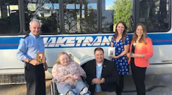 Laketran APEX Awards with bus. L-R Driver Rick Robinson, Trustee Donna McNamme, General Manager Ben Capelle, Communications Specialist Kerry Jonke, Director of Communications Julia Schick.