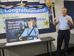 Harnisch, standing next to the photo that will be featured on the sides of buses throughout 2018, thanking the team that helped him reach this achievement. Harnisch, standing next to the photo that will be featured on the sides of buses throughout 2018, thanking the team that helped him reach this achievement.
