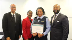 Director of Operations Sean Smith, Assistant County Administrator Faye W. Johnson, Bus Operator Graduate Aisha Marbury and Executive Director Clinton B. Forbes pose at a ceremony.