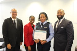 Director of Operations Sean Smith, Assistant County Administrator Faye W. Johnson, Bus Operator Graduate Aisha Marbury and Executive Director Clinton B. Forbes pose at a ceremony. Director of Operations Sean Smith, Assistant County Administrator Faye W. Johnson, Bus Operator Graduate Aisha Marbury and Executive Director Clinton B. Forbes pose at a ceremony.