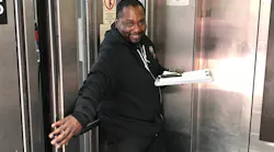 Elevator attendant Charles Jones greets customers at Powell Street Station in July 2018.