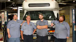 Four Heroes (pictured, L to R): Doug Gougeon, Larry Lautner, Steven Markel and John Baxter in front of a Blue Water Area Transit bus in the agency’s garage.
