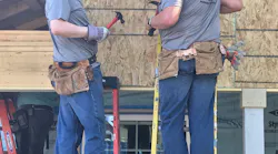 Trinity Metro President/CEO Paul J Ballard and Senior Vice President Bob Baulsir working on the TEXRail-sponsored Trinity Habitat for Humanity house in Fort Worth, Texas.