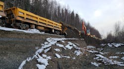 Crews work to repair a damaged portion of track following a 7.0 magnitude earthquake in Alaska.