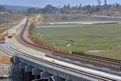 The completed concrete bridge with double track construction occuring in the background can be seen in this photo of the San Elijo Lagoon Double Track Project. The completed concrete bridge with double track construction occuring in the background can be seen in this photo of the San Elijo Lagoon Double Track Project.