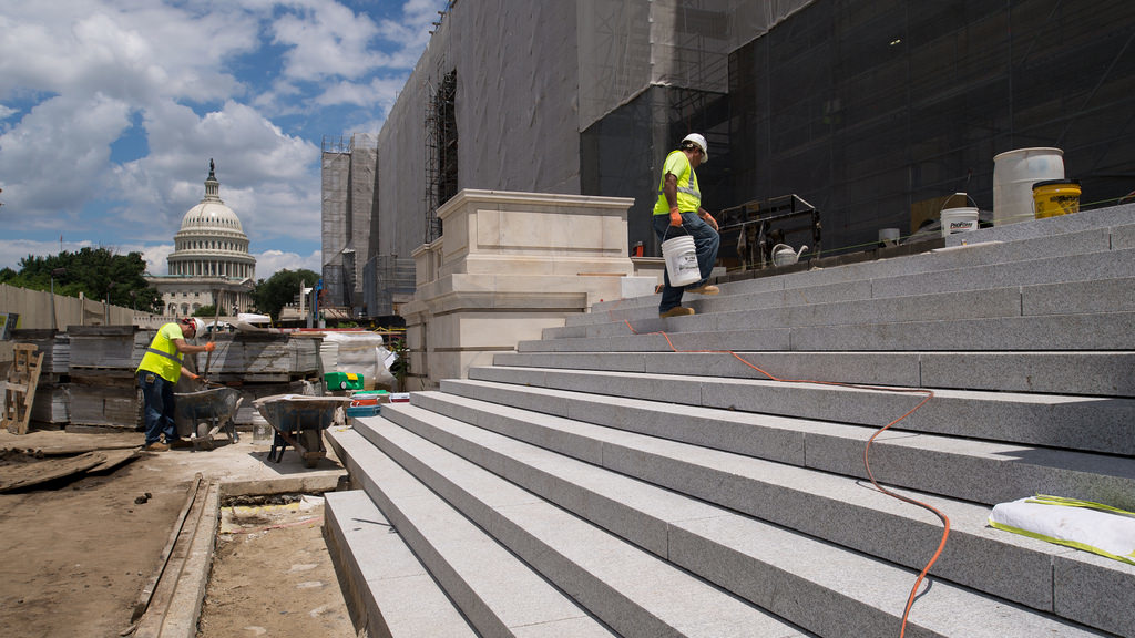 The dome of the U.S. Capitol sits in the background as work occurs for the Cannon Renewal Project in June 2018.